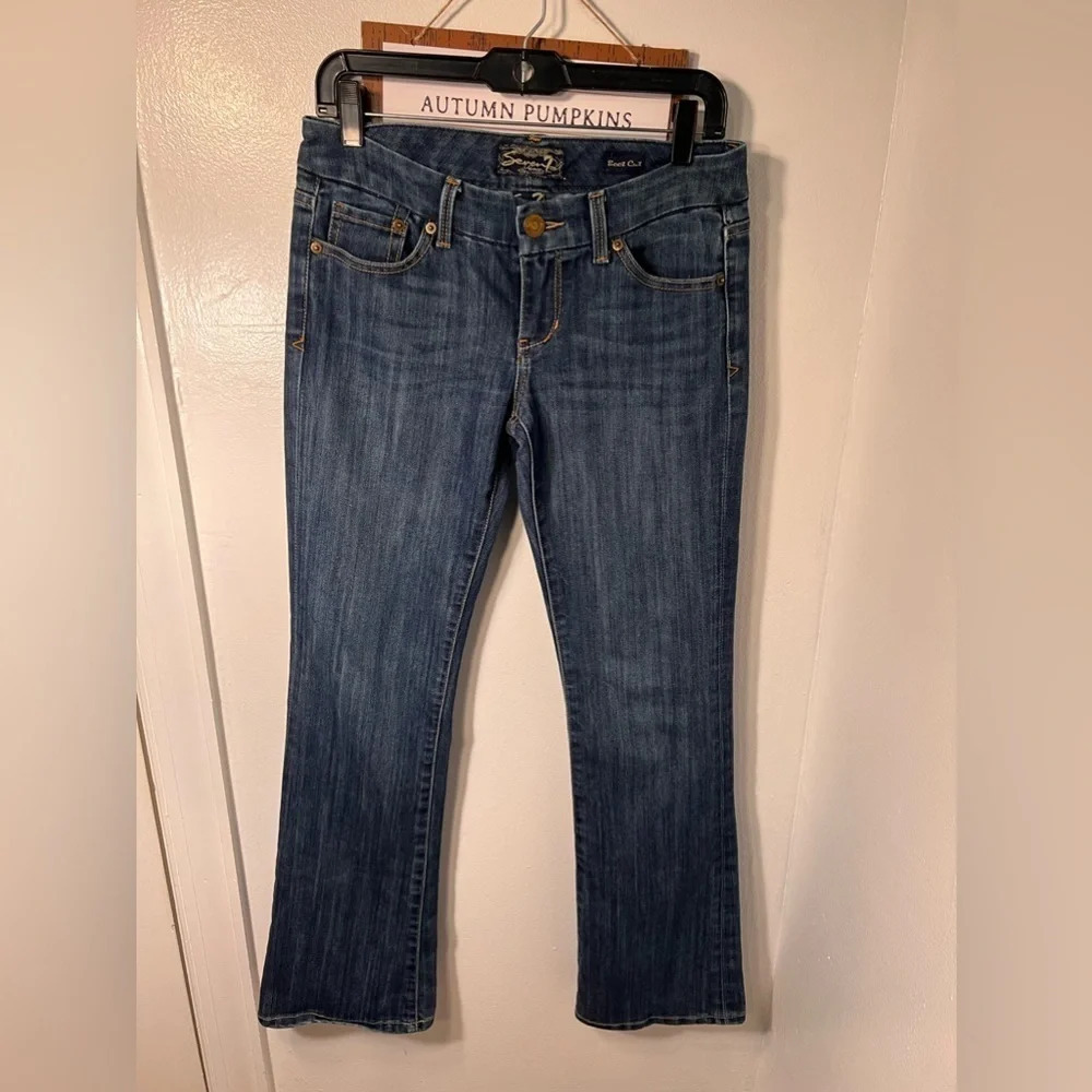 Seven7, boot cut sz 28, 5 pocket button zip detail back pockets medium wash
